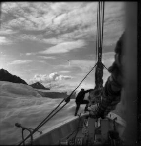 Image of Donald MacMillan re-boarding The Bowdoin, Umanak Fjord