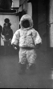 Image of Young Eskimo [Inuk] child in white furs