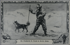 Image of Dr. Frederick Cook in Arctic Dress, on snowshoes, with dog
