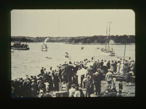 Image of The Bowdoin leaving; crowd on dock (B & W)