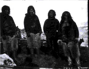 Image of 4 Inuit young men and dog