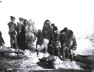Image of Inuit women and children with a crew member