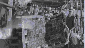 Image of Donald MacMillan, Mr. And Mrs. Field holding birdskin quilts on the BOWDOIN