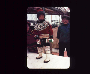 Image of Young West Greenland girl aboard, in dress outfit