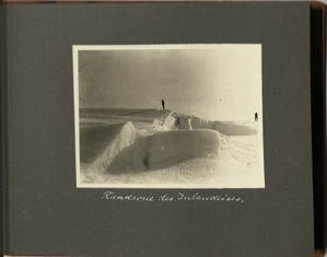 Image: Randzone des Inlandeises [Edge zone of the Inland Ice: man stands on crest of ice; another at far right]