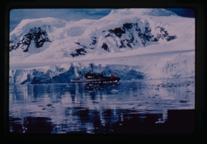 Image of Naval ship sailing by glacier