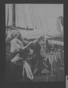 Image of Charles Percy on the Roosevelt securing (?) the sails