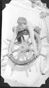 Image of Crewman leaning over wheel