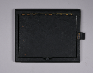 Image of Folmer Graflex backloading film cartridge with leather folding sides