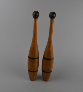 Image: Pair of Indian Clubs, natural wood with dark blue or black painted stripes