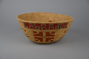 Image of Basket bowl with red, orange, green, and blue designs