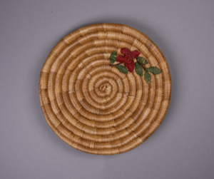 Image: Small basket plate with design of red flower and green leaves