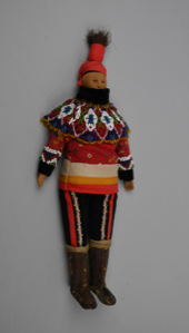 Image: Doll dressed in South Greenland costume with beaded collar and cuffs