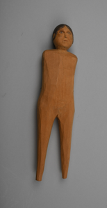 Image: Standing female doll, armless and footless, with penciled hair, eyes, and mouth