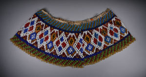 Image: Beaded collar predominantly red, white, and blue in diamond pattern