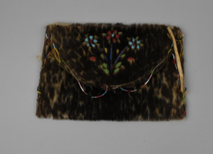 Image of Fur pouch with flap of sealskin, lined in cotton and beaded floral design