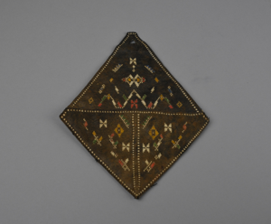Image of brown leather mosaic work case, diamond-shaped with blue floral lining
