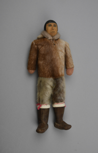 Image: male doll with dressed in sealskin hooded parka, breeches, and boots