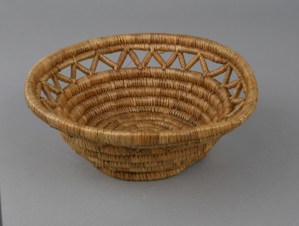 Image: woven grass basket in open work style
