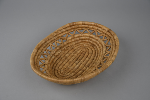 Image: woven grass flat serving basket with open work