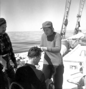 Image: Miriam cutting hair on deck