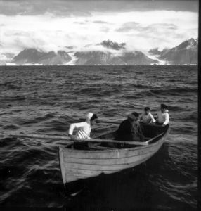 Image of Eskimos [Inuit] in open boat approaching The Bowdoin