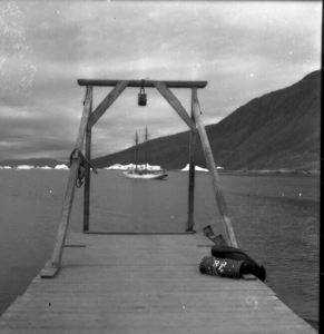 Image of The Bowdoin framed by dock, Nugatsiak