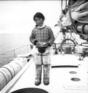 Image of Little girl with sealskin bag