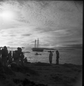 Image of Crowd on shore looking at the Bowdoin, Thule