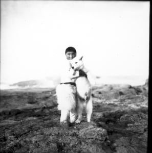 Image: Boy holding dog, Thule