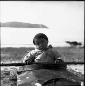 Image of Little Eskimo [Inuk] boy in Kayak, Savigsivik