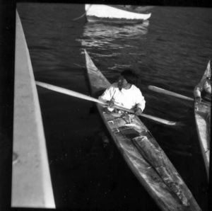 Image of Eskies [Inuit] in kayaks, Inglefield Fjord