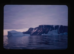 Image of iceberg in sunset colors