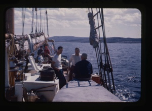 Image of deck activity. Donald and Miriam MacMillan at wheel