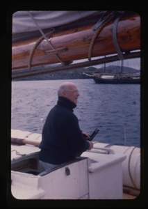 Image of Donald MacMillan, hatless, on deck