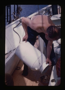Image: Bill Powers on deck, preparing water can