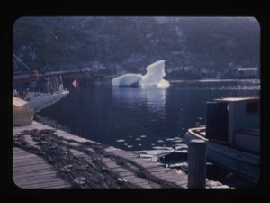 Image of Bowdoin's stern, iceberg beyond