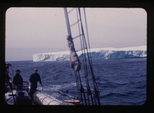 Image of iceberg through rigging, MacMillan and Barney on deck