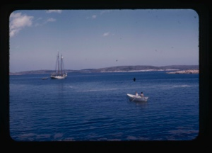 Image: the Bowdoin moored. Dory in foreground