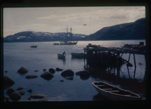 Image: the Bowdoin and small boats near dock