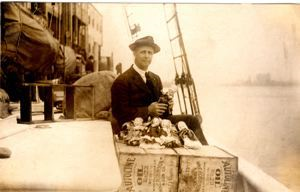 Image of Donald MacMillan with Dolls on Pier