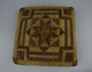 Image of Seal fur patchwork pillow with star