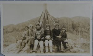 Image: Sukkertoppen flapp[ers] taken during MacMillan Expedition [women sitting at base of flagpole]