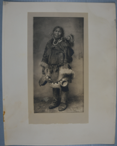 Image of North Alaskan adult female and baby dressed in fur clothing