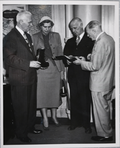 Image: Donald and Miriam MacMillan and Harold Leland of the Hood Rubber Company, before