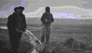 Image of Robert Bartlett, ?, and Eskimo [Inuk] beside whale bone