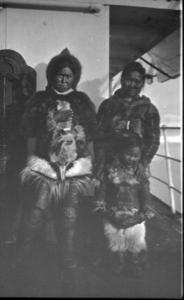 Image of Two Eskimo [Inuit] women and a child on deck