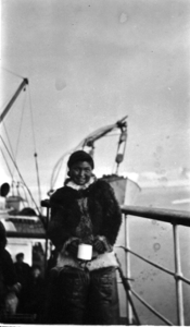Image: Eskimo [Inuk] woman with mug on deck