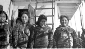 Image of Four Eskimo [Inuit] women on deck, smoking