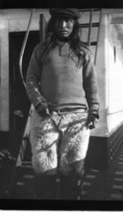 Image: Eskimo [Inuk] man on deck, in polar bear pants